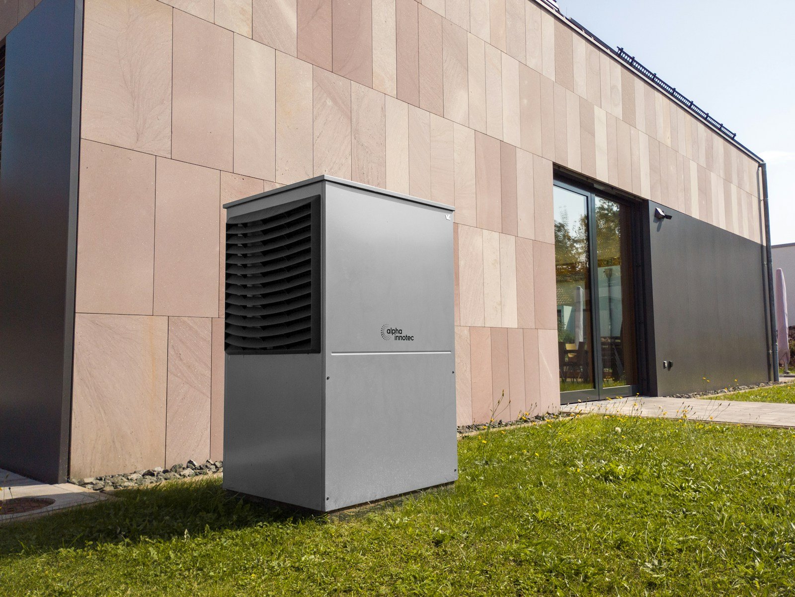 Outdoor heat pump unit in front of a house