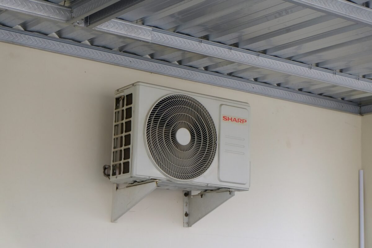 Ductless mini-split outdoor unit mounted on a residential wall